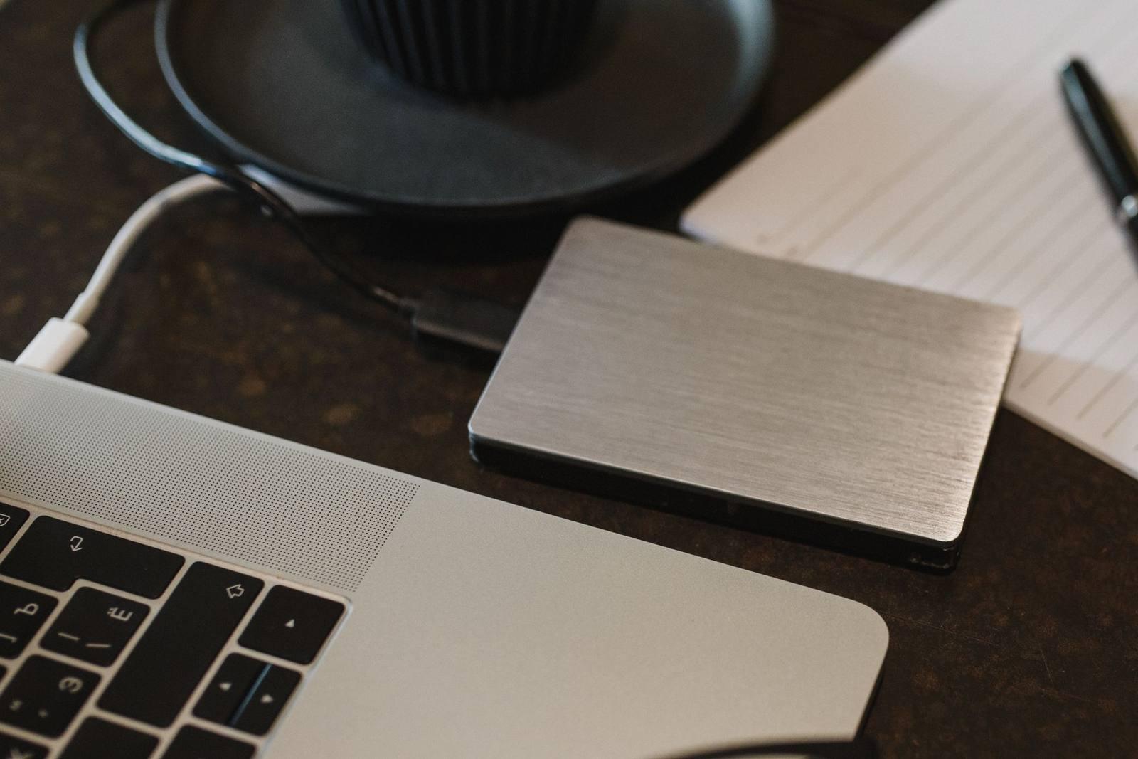 An external backup drive connected to a laptop