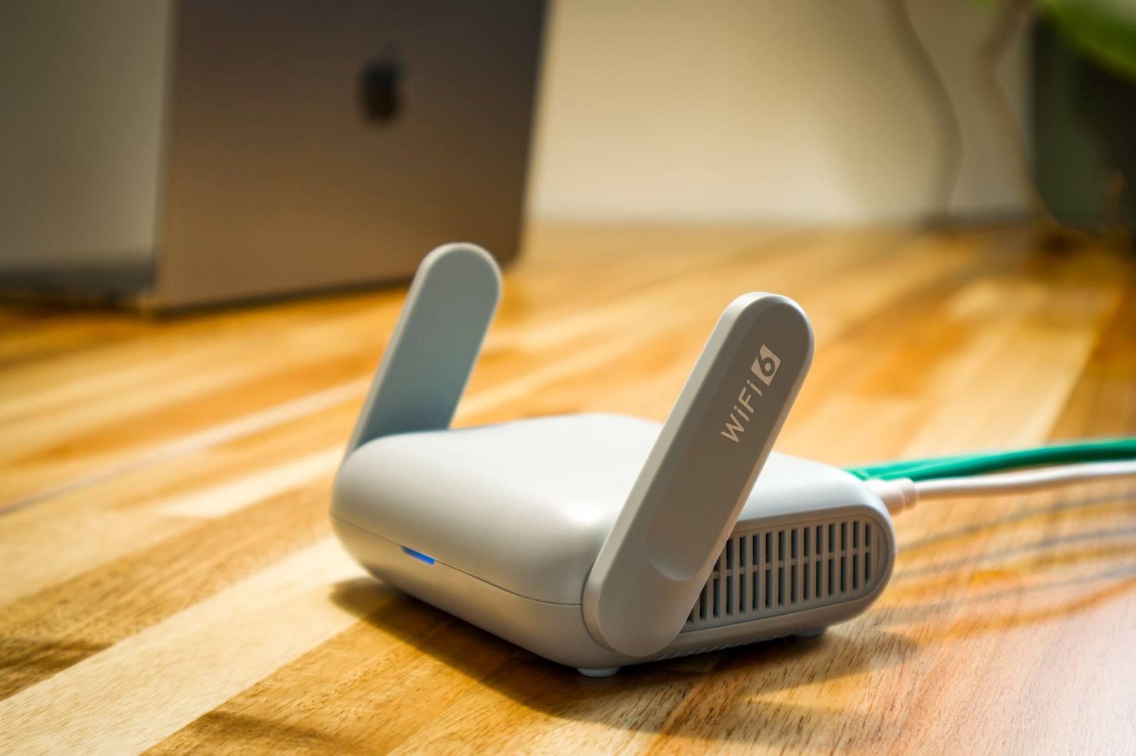 Modern Wi-Fi router set up on a desk