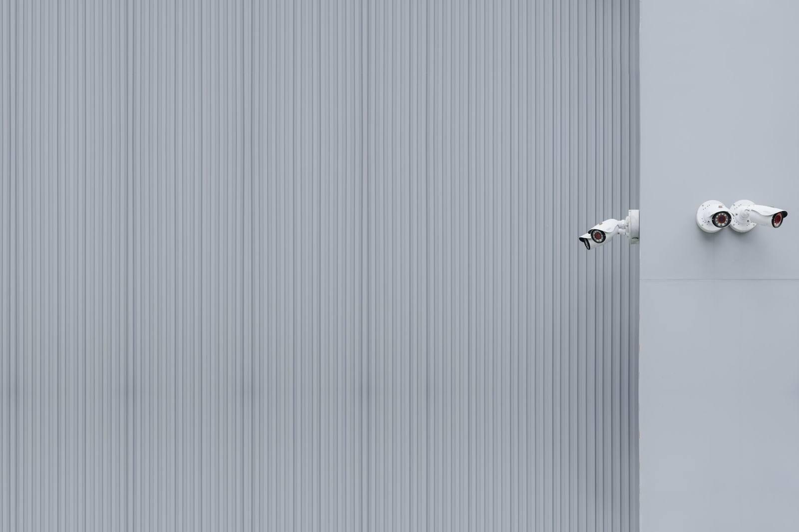 Modern security cameras mounted on an exterior wall